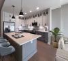 Carraway Village kitchen with island, stainless steel appliances, and custom cabinets