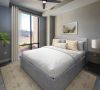 Carraway Village bedroom with plush carpeting, large windows, vaulted ceiling, and modern bedroom furniture