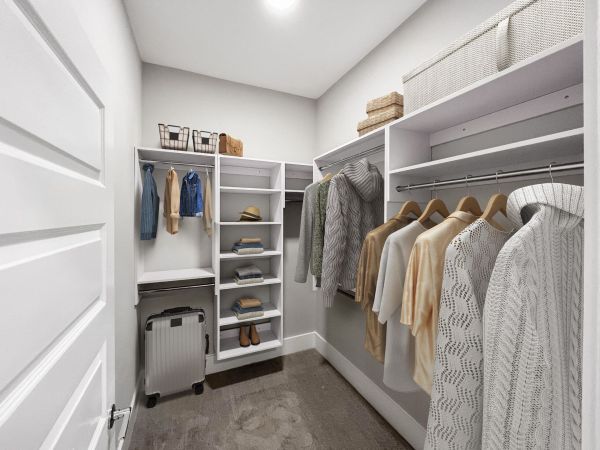 Large walk-in closet in Chapel Hill apartment with custom shelving
