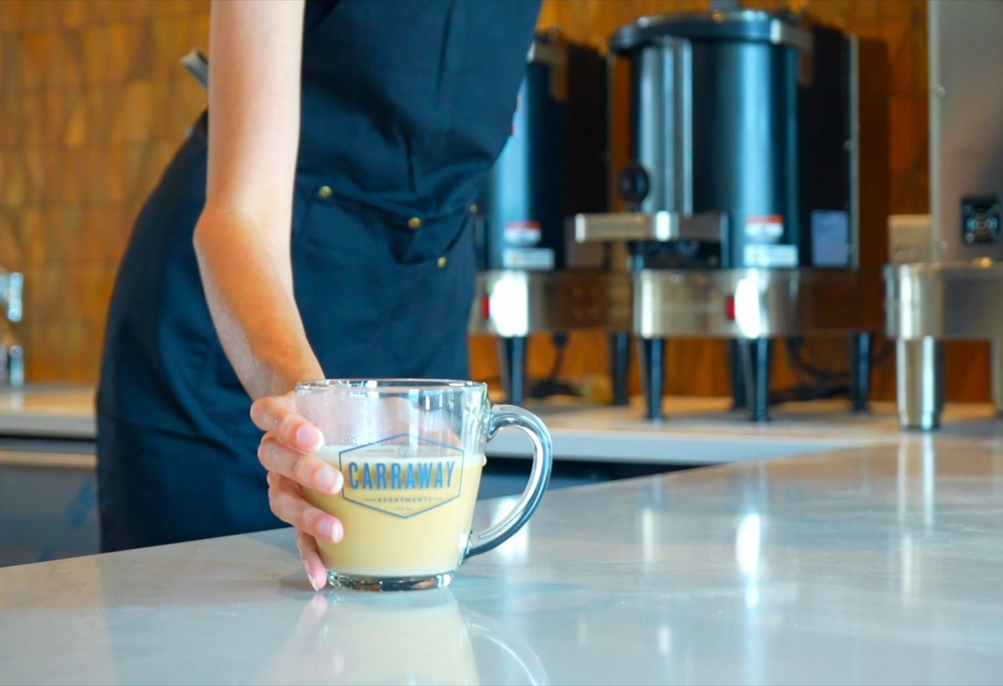 On-site barista serving free coffee to residents