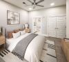 1 bedroom apartment showing a large bed, large closet, and entrance to bathroom