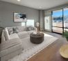 Carraway Village living area with large windows, patio access, and modern furnishings